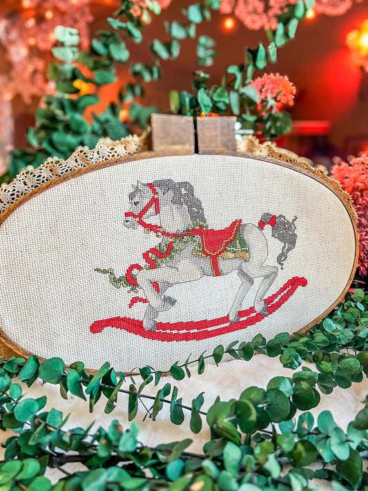 Handmade carrousel cross-stitch